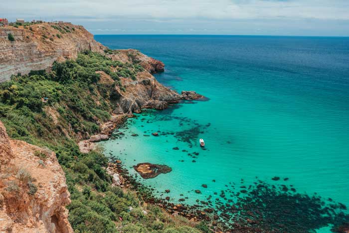 Overlanding in Europe at an Azure-Sea bay
