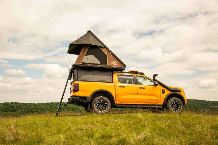 The Explore One Hardshell Rooftop Tent camping in the mountains