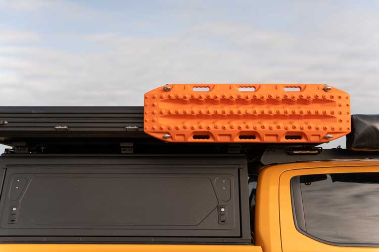 Front view of traction boards mounted on rooftop tent using the mounting brackets.