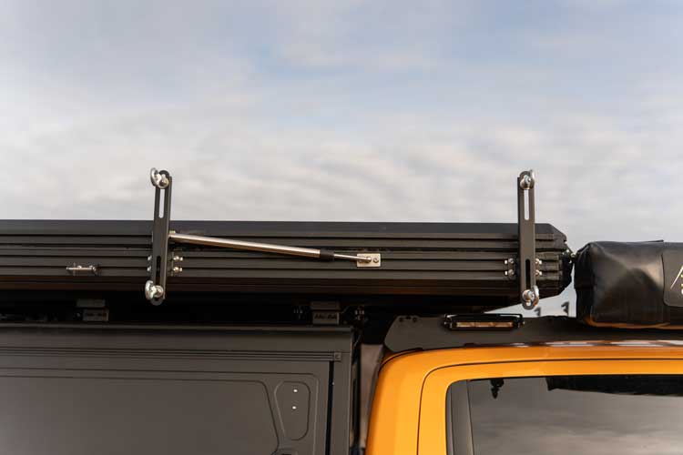 Rooftop tent traction board holder brackets mounted on the Explore One car tent.