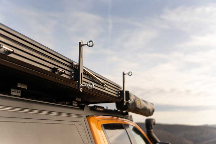 Left hand side view of the brackets used for installing traction boards on an Explore One rooftop tent.