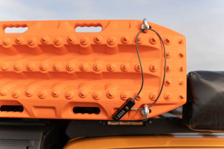 Steel loop lock used for securing the traction boards to the rooftop tent brackets to prevent theft.