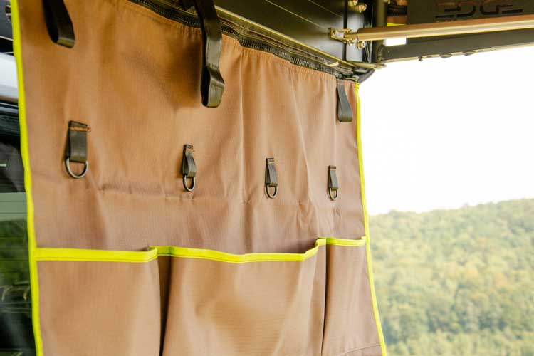 Hook points used for hanging different items on the Shelter Max organiser pockets.